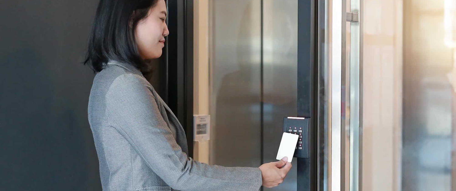 Business-person-using-card-reader-to-open-door