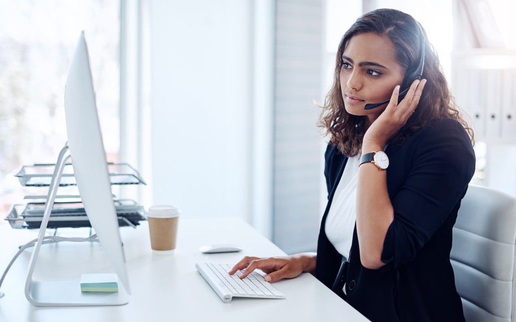Woman with Headset on a Voice Call