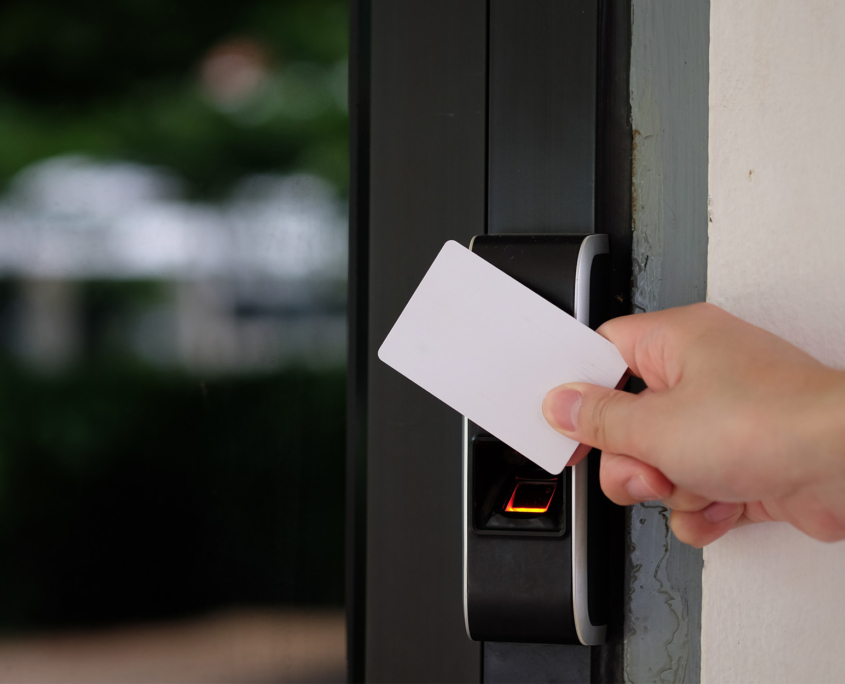 Electronic key access system with hand inserting key card to unlock door