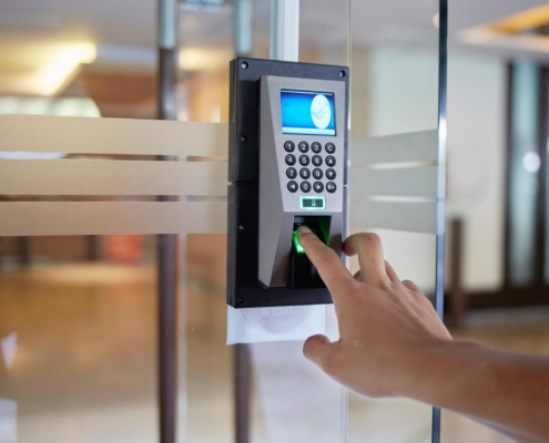 Worker using keypad to access commercial building