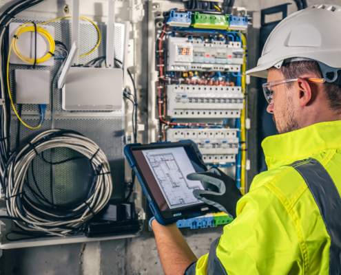 worker inspecting electrical system