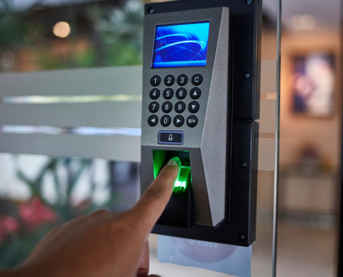 Worker using door access system at building
